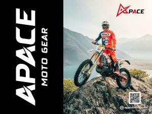 Motocross rider wearing Apace Moto Gear stands on a mountain peak overlooking the valley, representing the brand’s bold, high-performance 2025/26 motocross collection.
