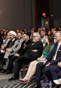 Mark Savaya (center) and community leaders during a policy forum on U.S.–Iraq relations.