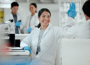 Scientists celebrating successful qPCR runs after successful training in the qPCR & Pathogen Detection Circle