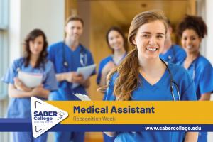 Group of medical assisting students in blue scrubs smiling and holding clipboards in a bright hallway, representing SABER College’s Medical Assistant Recognition Week.