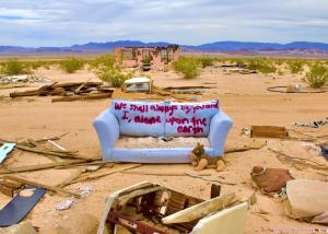 Photo of abandoned sofa in the desert