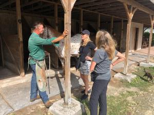 Jennifer Skiff and Laurie Hood discuss the state of disaster with farrier