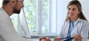 Image of counselor and patient discussing insurance coverage