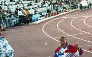 Man in a wheelchair on a track field.