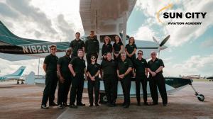 Sun City Aviation Academy team posing with Seaplane trainer