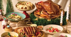 Christmas dinner buffet setup with festive decorations, tropical touches, and guests enjoying holiday dishes at Courtyard Phuket Patong Beach Resort.