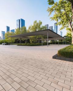 Commercial Parking with Techo-Bloc Blu Smooth 6x13 Permeable Pavers in Caffè Crema