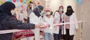 A young cancer patient cuts the ribbon to open a new Wareef Charity initiative at KFSHRC.