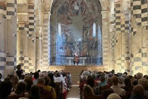 View of the audience inside the Abbey of Santa Giustina in Sezzadio during Alexander Hülshoff’s cello performance, part of the Echos International Music Festival 2025 hosted at Villa Badia and supported by Dazhun Zhang.