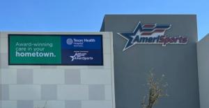 Texas Health Rockwall & AmeriSports Exterior Signage Facing Interstate 30 - saying "Award-winning care in your hometown. Texas health Rockwall Hospital.