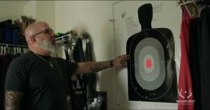 Inside his home, Steven Parker transformed a closet into a makeshift safe room. The human silhouette target taped to the door reflects the lingering sense of threat that can remain long after the uniform comes off.