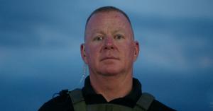 Donnie Penix pauses for a moment of reflection, the weight of years of service visible in his expression. Like many first responders, he carries the unseen burdens that come with a life spent protecting others.