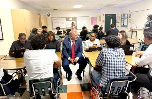 Tom Milana meeting McArthur High School students during Junior Achievement 3DE kickoff session on business brokerage and entrepreneurship education.