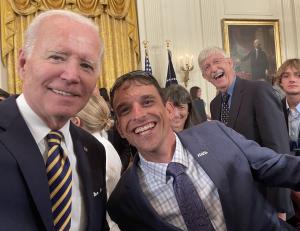 President Joe Biden and National Veteran Advocate Eric Donoho celebrating at the White House