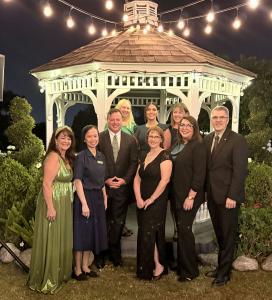 A group photo of Maryvale President and CEO Steve Gunther with senior leadership, associates, and board members at the San Gabriel Valley Economic Partnership’s 2025 Emerald City-themed Awards Gala, where Maryvale was honored as Nonprofit of the Year.