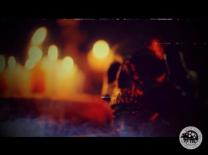 dark image of candles and skull