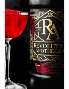 Photo of RA Cosmic Cloud bottle with bright purple THC-infused beverage from Revolution Apothecary.