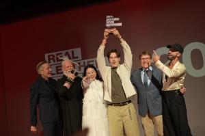 Jamie Unlu O’Grady, the 2025 Real Leather. Stay Different. International Overall Winner, celebrates their win with the judging panel and Kerry Brozyna, President of the Leather & Hide Council of America, at the awards ceremony in Taipei