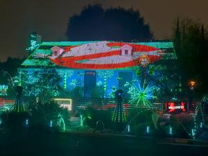 Halloween house display with 100,000 synchronized LED lights performing a Ghostbusters music sequence on Falcon Avenue in Long Beach.