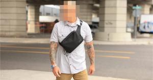 Man with blurred face wearing a SLNT® Concealed Carry Faraday Sling