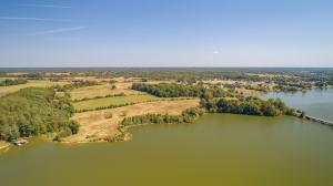 110.1± acres with 1,980± feet of Lake Anna frontage on the cool side (“Terry’s Run”). 3 BR / 2 BA farmhouse with 1,526± sq. ft., hardwood floors, and front & side porches . Kitchen with all appliances, living room, dining room, unfinished basement & attic.