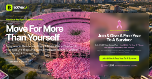 Aerial view of a stadium filled with pink balloons representing breast cancer awareness, symbolizing Bodyby.AI’s Power in Motion campaign that gifts a free year of fitness and nutrition to survivors.