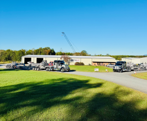 Perimeter trailers attached to semi tractors in front of ProLift Rigging's facility buildings in Lynchburg, VA