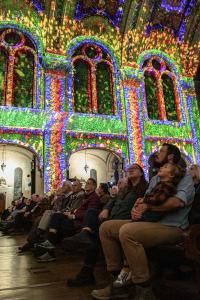 A family with a young child takes in "LUMINISCENCE' inside The Basilica of Saint Mary, Minneapolis