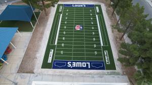 mini football field made of synthetic turf featuring logo designs