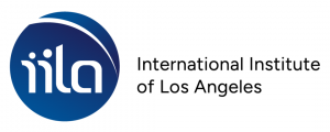 International Institute of Los Angeles logo – A blue circular emblem with the lowercase letters “iila” in white, stylized with rounded edges and dots above the “i” shapes, followed by the organization’s name “International Institute of Los Angeles” in bla