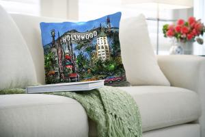 Sumptuous Hollywood Pillow with Beverly Hills Hotel in fun cityscape on a couch