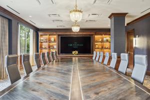 The Mahogany Boardroom's one-of-a-kind board table seats 20 guests and was handcrafted in Aransas Pass by Texas artisan Herb Lancaster.