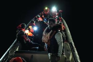 Sammy Sheik in a boat scene from RUN, directed by Uwe Boll, showing migrants at sea off the Italian coast.