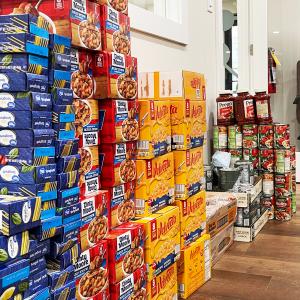 BPX meeting room full of non-perishable goods donated from the first day of The Pantry Project