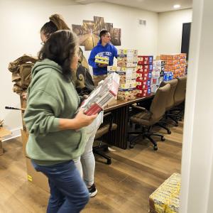 The Biopathogenix team putting together food boxes  to feed families of 4 across Jessamine County