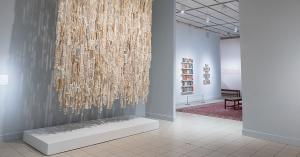 View of a large gallery with multiple artworks