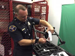 Tom Calvert inspecting a drone during his time as Battalion Chief with Menlo Park fire.