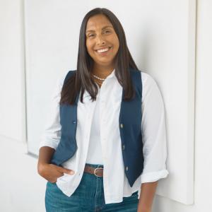 Alicia Johnston standing against a wall