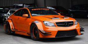 Orange Mercedes Sports Car with Cascade Garage carbon fiber aero kit.