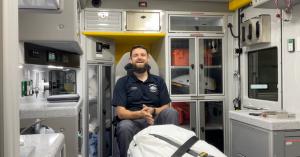 Mason Holmes, Supply Officer and Paramedic at Broken Bow EMS, in the back of an ambulance using OneDose and OneWeight