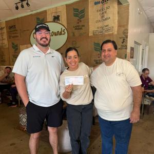 Matt and Vanessa with an employee at Our Grounds