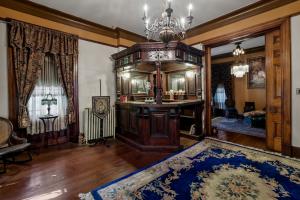 7-bedroom, 4.5-bath Victorian residence sits on a .27± acre lot and includes a detached 1BR/1BA guest cottage/office, a detached pool house with garage/carriage house, and a beautiful courtyard with an in-ground saltwater pool.