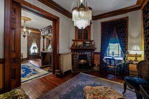 7-bedroom, 4.5-bath Victorian residence sits on a .27± acre lot and includes a detached 1BR/1BA guest cottage/office, a detached pool house with garage/carriage house, and a beautiful courtyard with an in-ground saltwater pool.