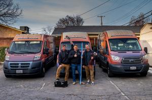 Three technicians from Super Brothers Plumbing Heating & Air stand in front of branded vans in Citrus Heights, California — representing trusted HVAC and plumbing service in the Sacramento region.