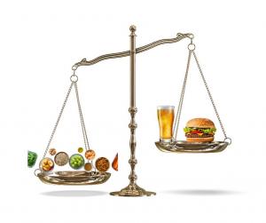 Restoring Metabolic Balance illustration showing a scale weighing healthy natural foods against junk food, symbolizing Dr. Bomi Joseph’s Deep Health® research on diet and obesity.