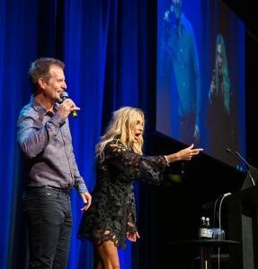 Shane and Rachel Krider presenting at a past Super Sunday, delivering business and personal development training.
