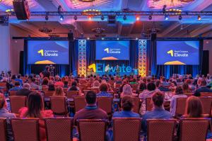 Full conference room of people watching the Psych Congress Elevate Keynote presentation.