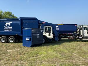 Top Dog Waste Solutions dumpsters and trucks, ready for prompt commercial dumpster rental delivery
