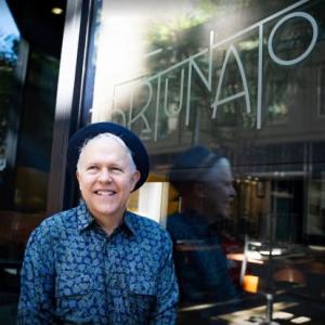 Sam Austin stands in front of Fortunato Restaurant in downtown Roanoke Virginia; photo credit Andrew Adkins