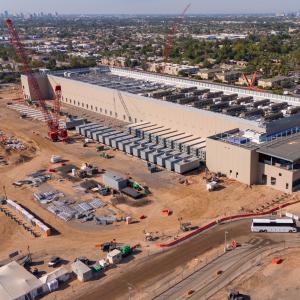 Aerial view of a data center construction site showing perimeter development and infrastructure expansion.